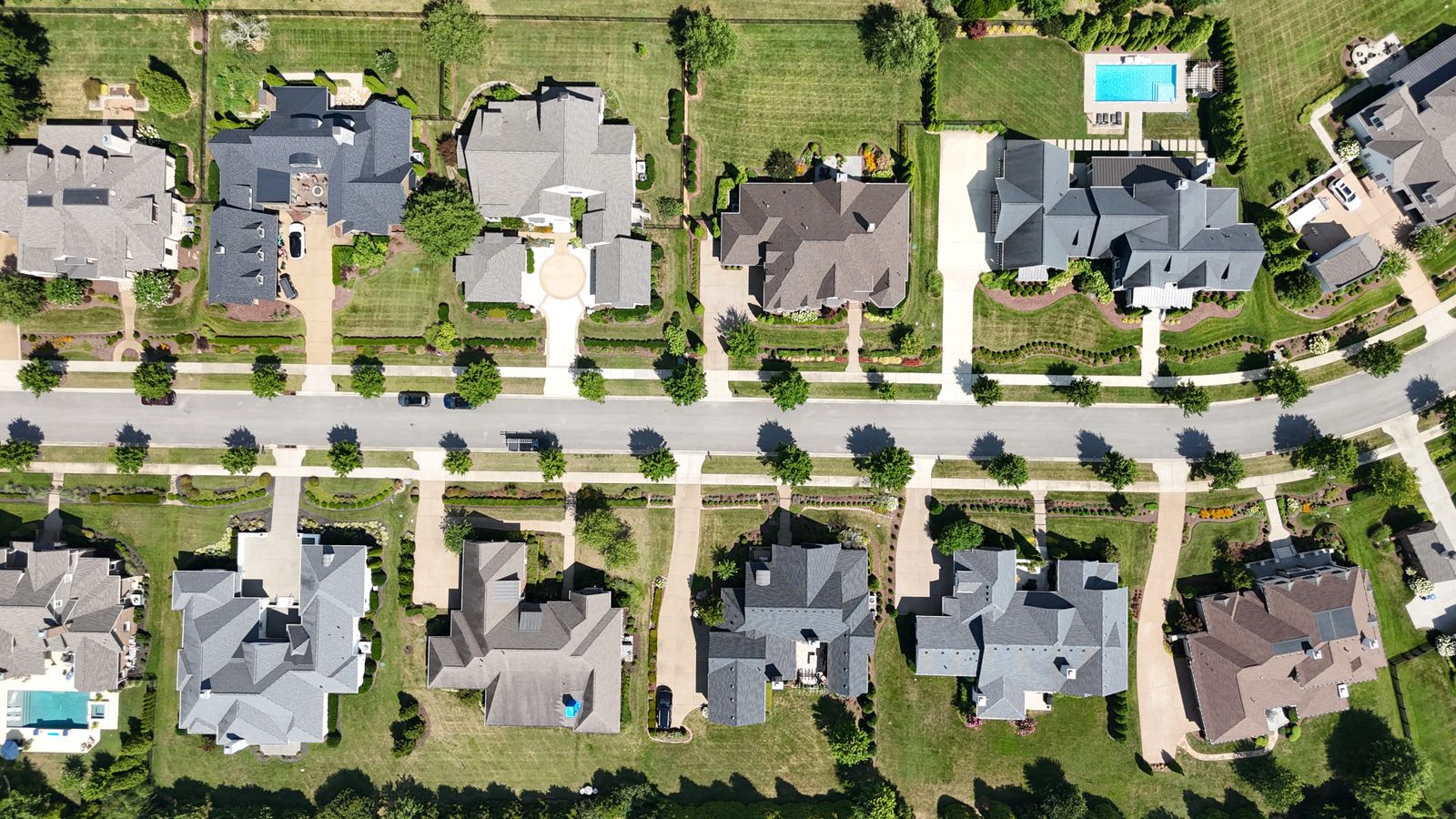 Aerial view of a master-planned neighborhood of large homes on curving streets